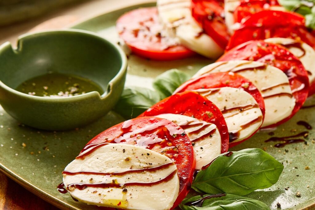 Candy Cane Caprese Salad on a green plate.