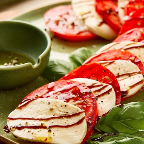 Candy Cane Caprese Salad on a green plate.