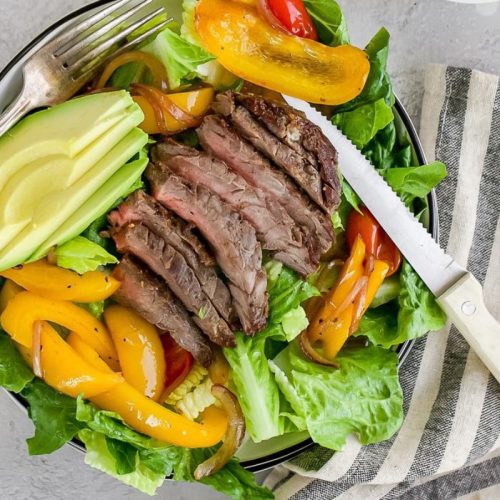 Steak Fajita Salad with a knife.