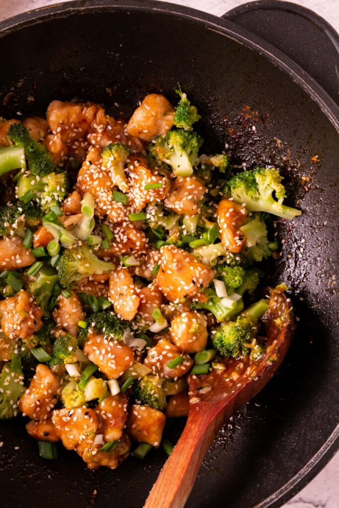 Honey Garlic Chicken with Broccoli in a cast iron pan.