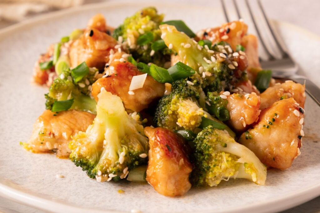 Honey Garlic Chicken with Broccoli on a white plate.