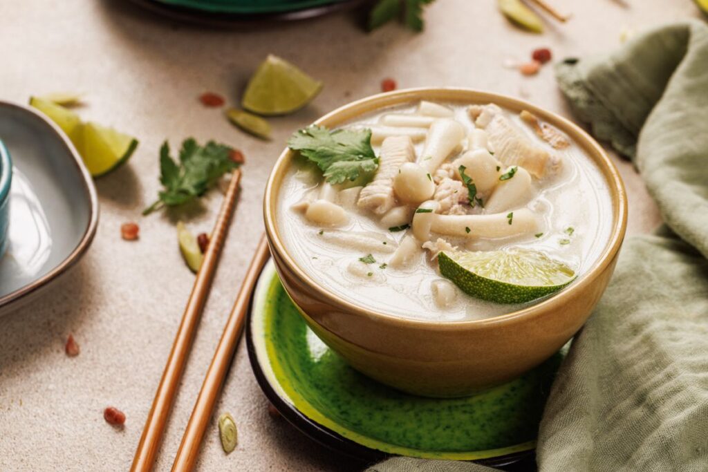 Diabetic-Friendly Thai Coconut Chicken Soup in a bowl with chopsticks.