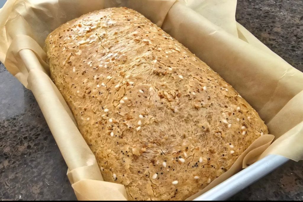 A loaf of psyllium bread in a pan.