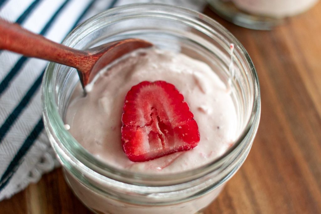 Keto Strawberry Cheesecake in a glass mason jar.