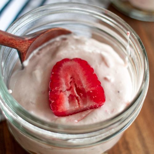 Keto Strawberry Cheesecake in a glass mason jar.