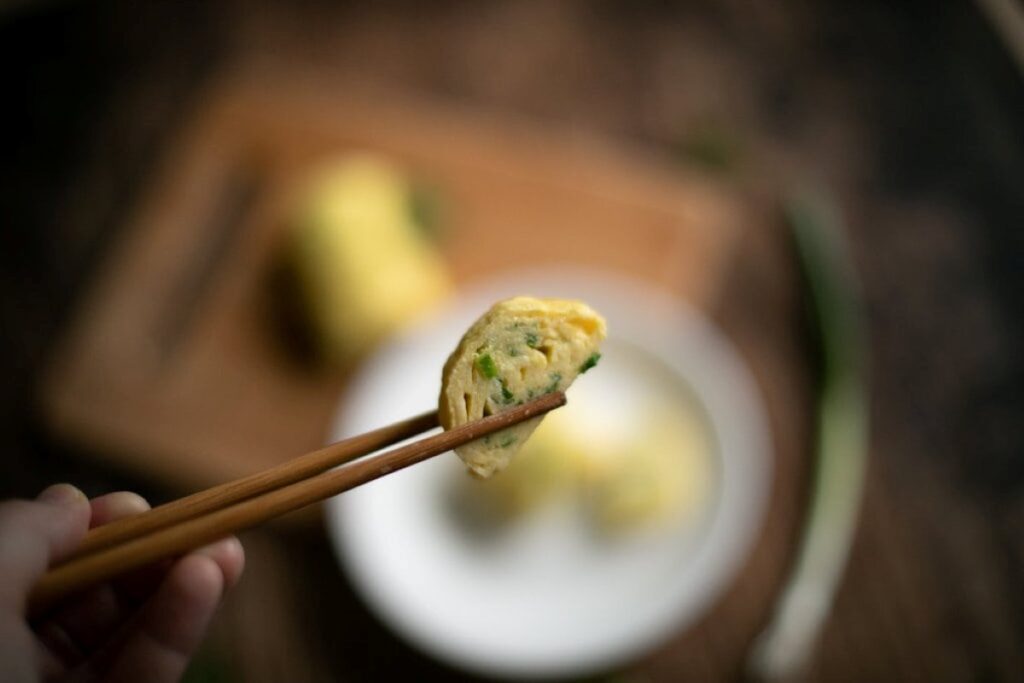 A Breakfast Egg Roll bite close up.
