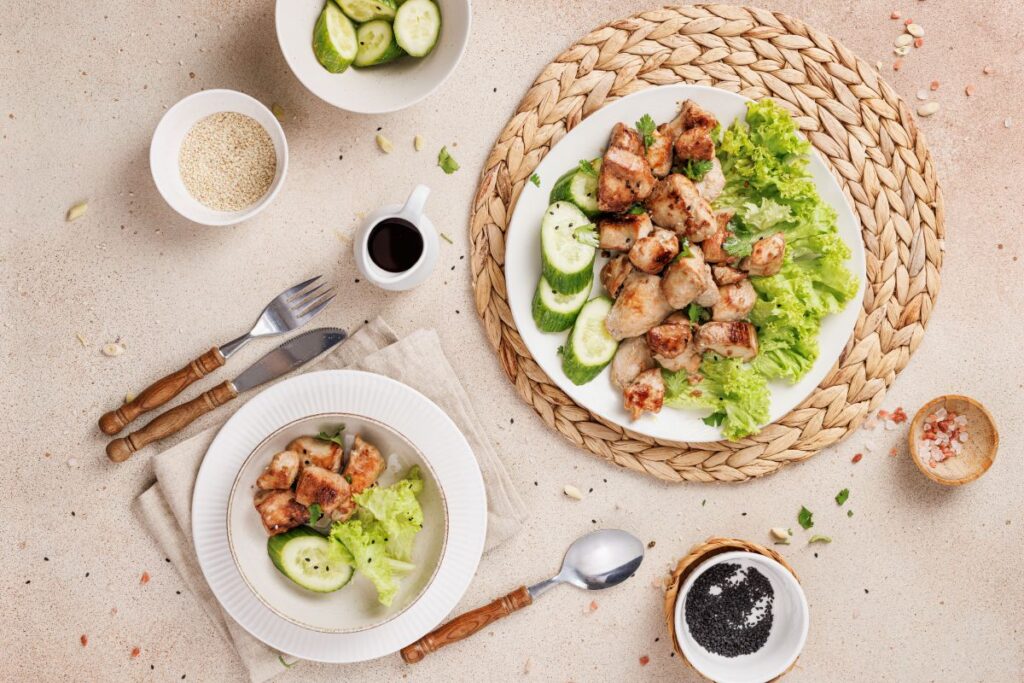 Lemongrass Chicken on two plates with veggies.